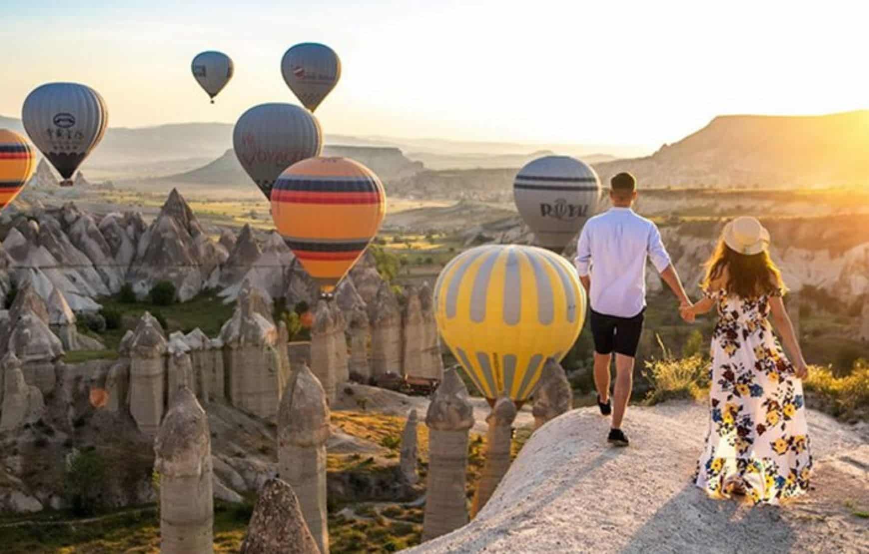 a couple watching balloons at Cappadocia Balloon Watching Tour