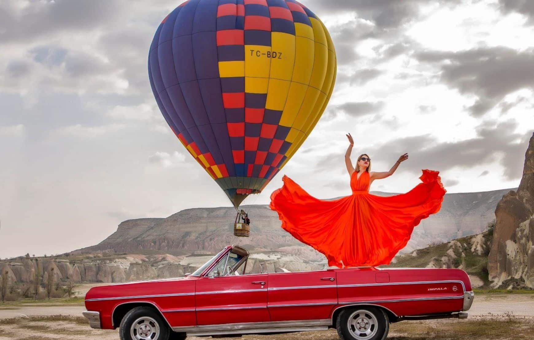 a woman standing up on a car in our Cappadocia Classic Car Tour