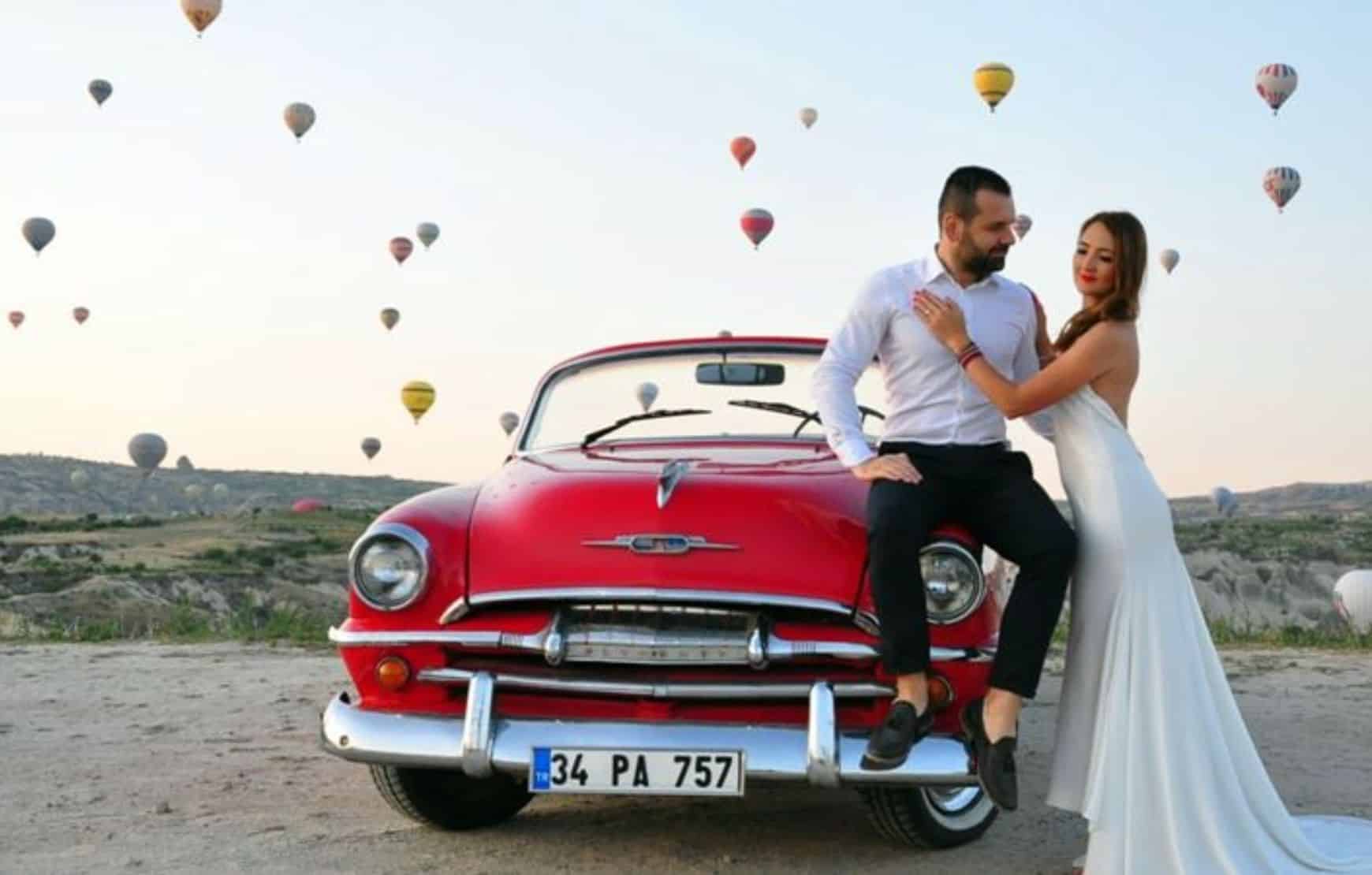 a wedding couple taking picture at our Cappadocia Classic Car Tour