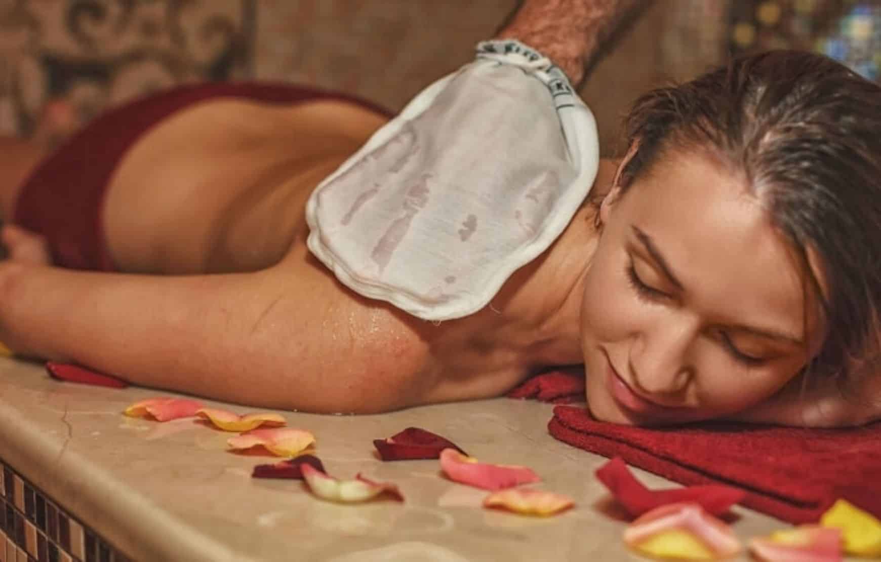 Turkish Bath in Cappadocia - woman scrubbing in hammam